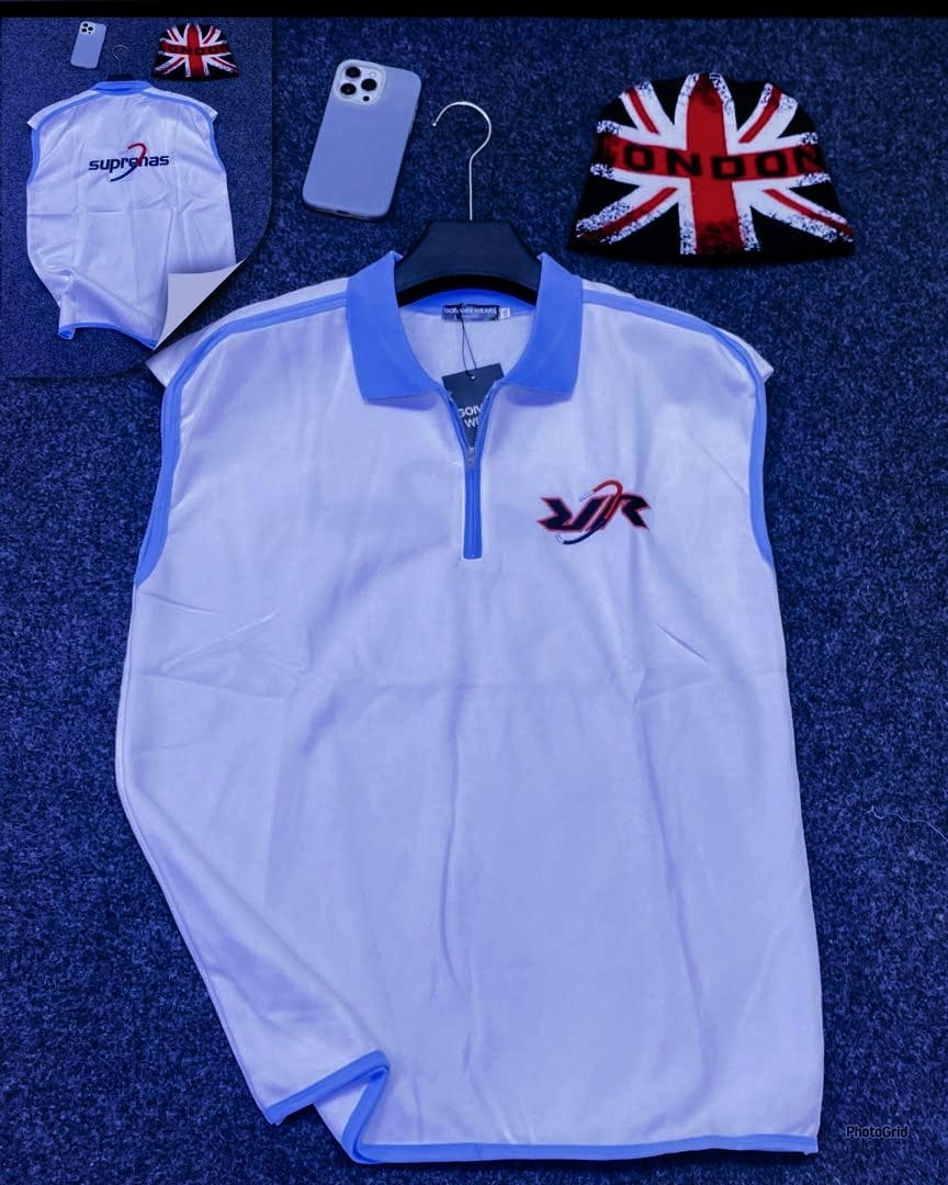 White armless quarter-zip polo with chest logo and suprenas back detail.