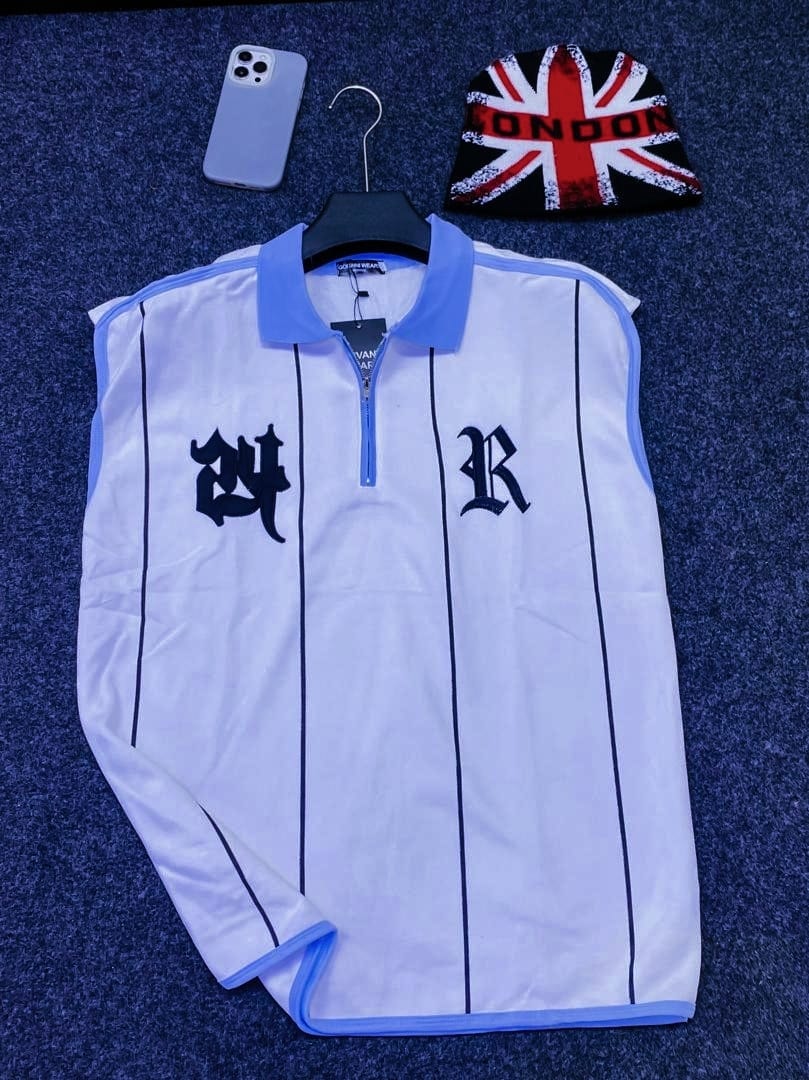 White armless polo with black pinstripes and 24 R embroidery.