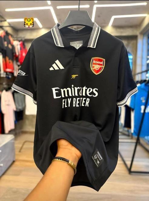 Black Arsenal polo jersey with Emirates Fly Better sponsor.