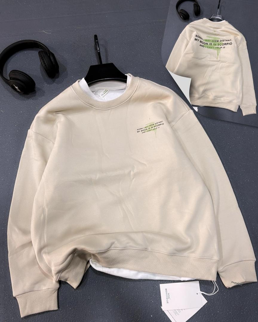 Cream sweatshirt featuring Scorpio moon quote in green with back view.