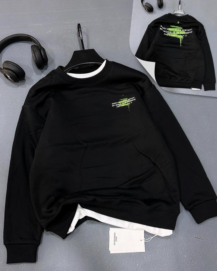 Black sweatshirt with green Scorpio text on front and back quote display.