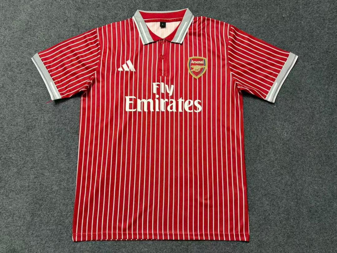 Red and white striped Adidas Arsenal Fly Emirates polo shirt laid flat.