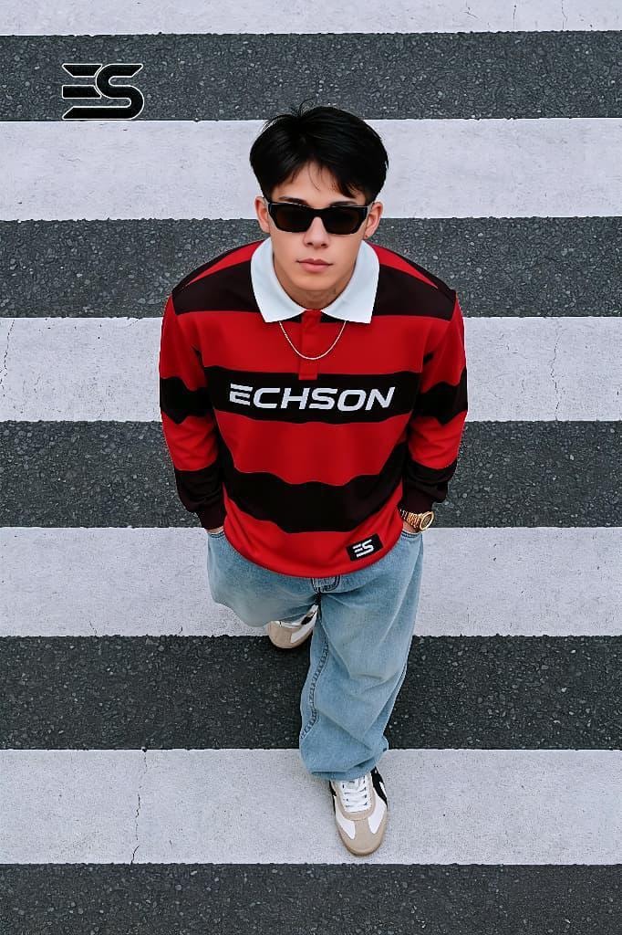 Model wearing red and black striped long sleeve polo with ECHSON chest print.