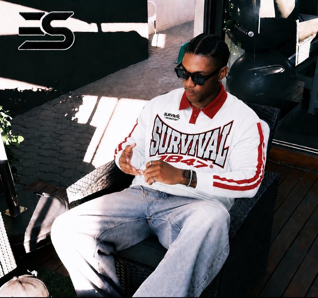 White long sleeve polo with red collar, stripes and SURVIVAL 1847 chest graphic.