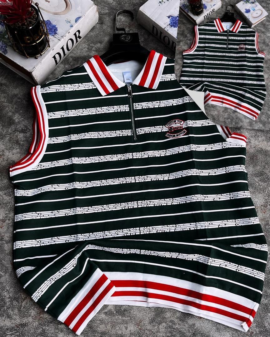 Green striped quarter-zip armless polo with red and white trim, flat lay view showing front and collar details.