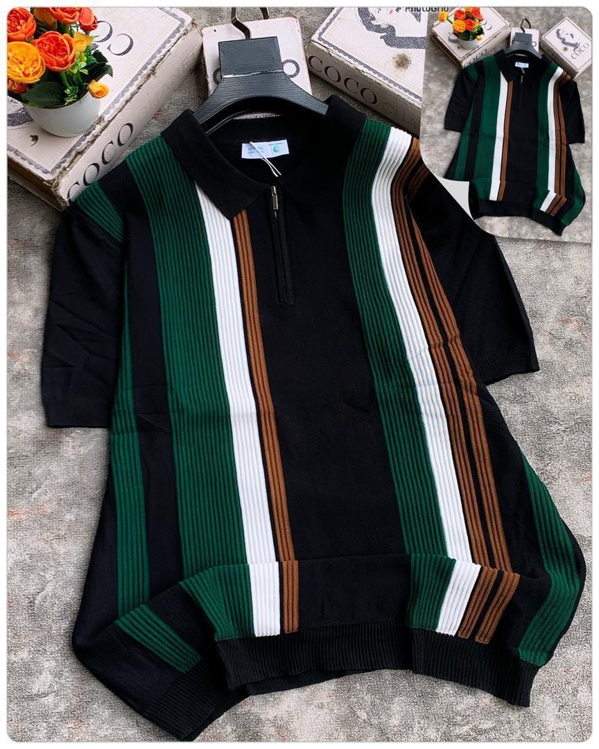 Black vertically striped ribbed polo shirt with green, white, and brown accents.