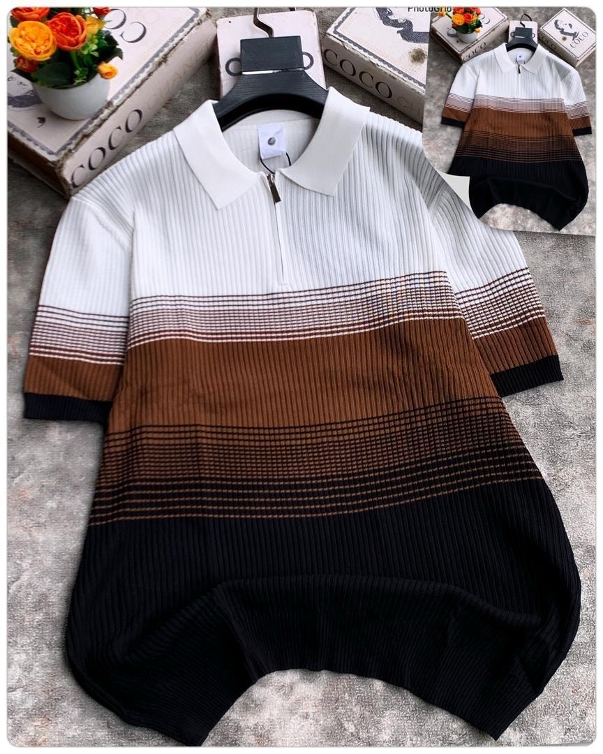 Black horizontal colorblock ribbed polo shirt with white collar and quarter zip.