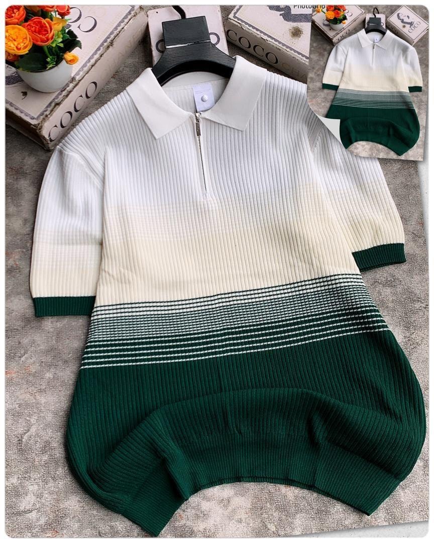 Green horizontal colorblock ribbed polo shirt with white collar and quarter zip.