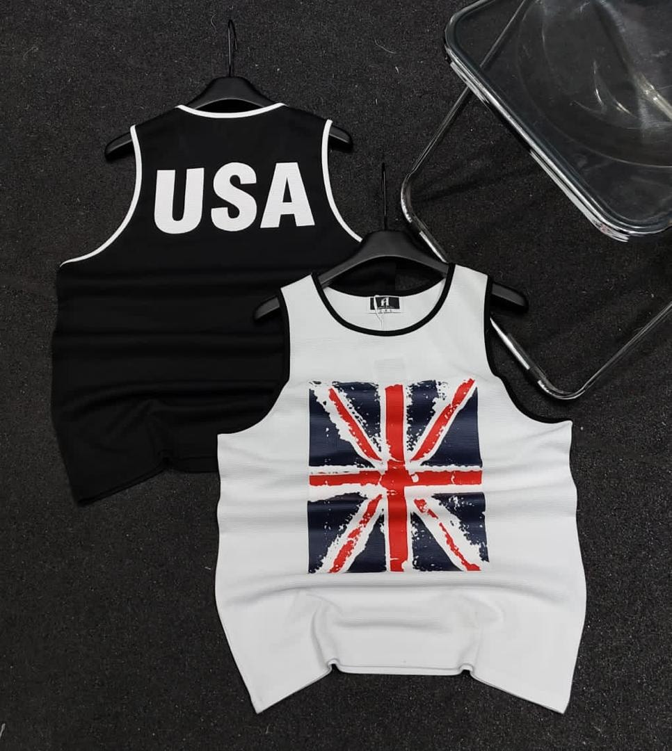 Black armless polo with white USA text on back and white armless polo with Union Jack graphic on front.