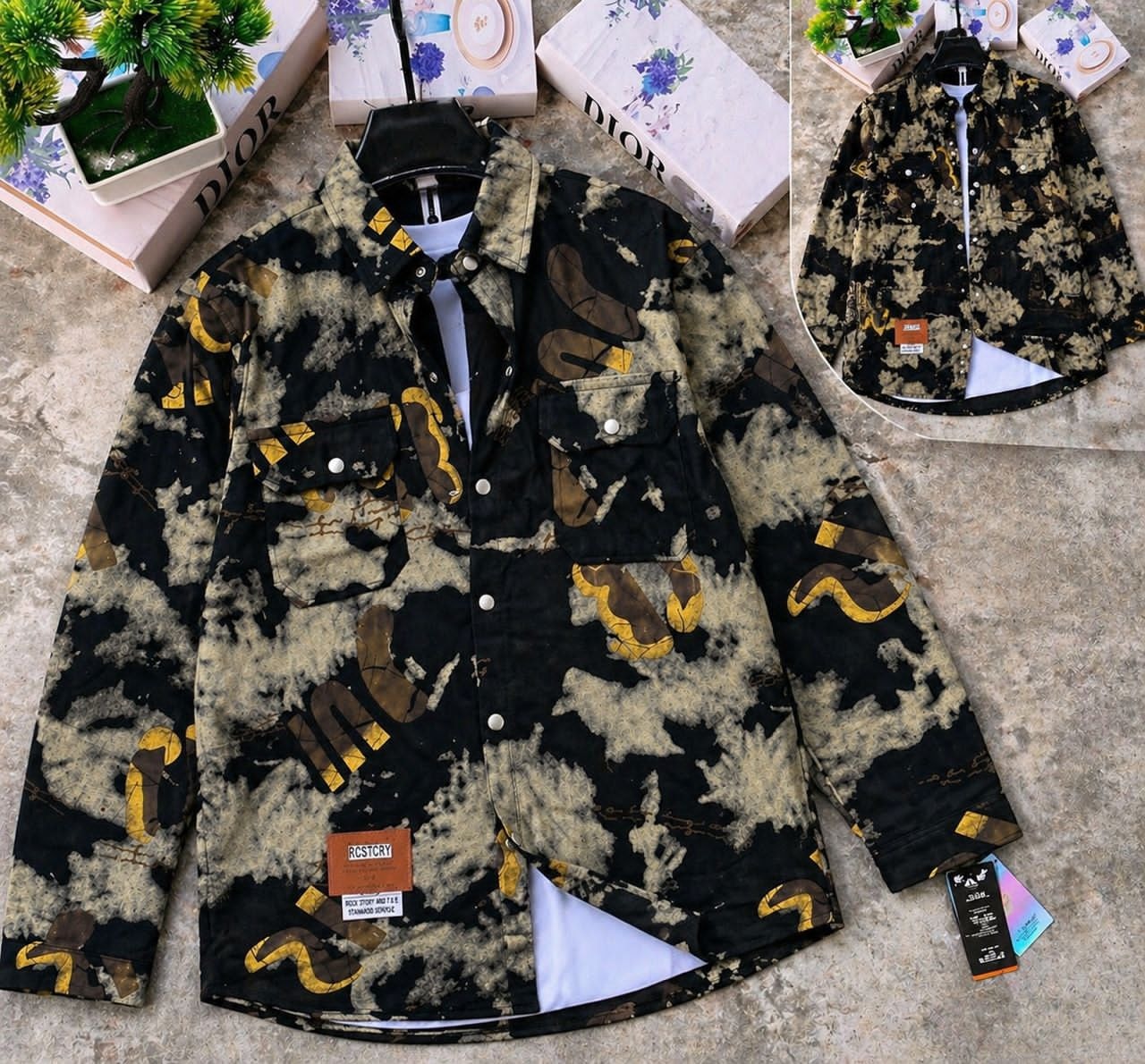 Black denim jacket with yellow and brown snake patterns, shown with white tee and back inset.