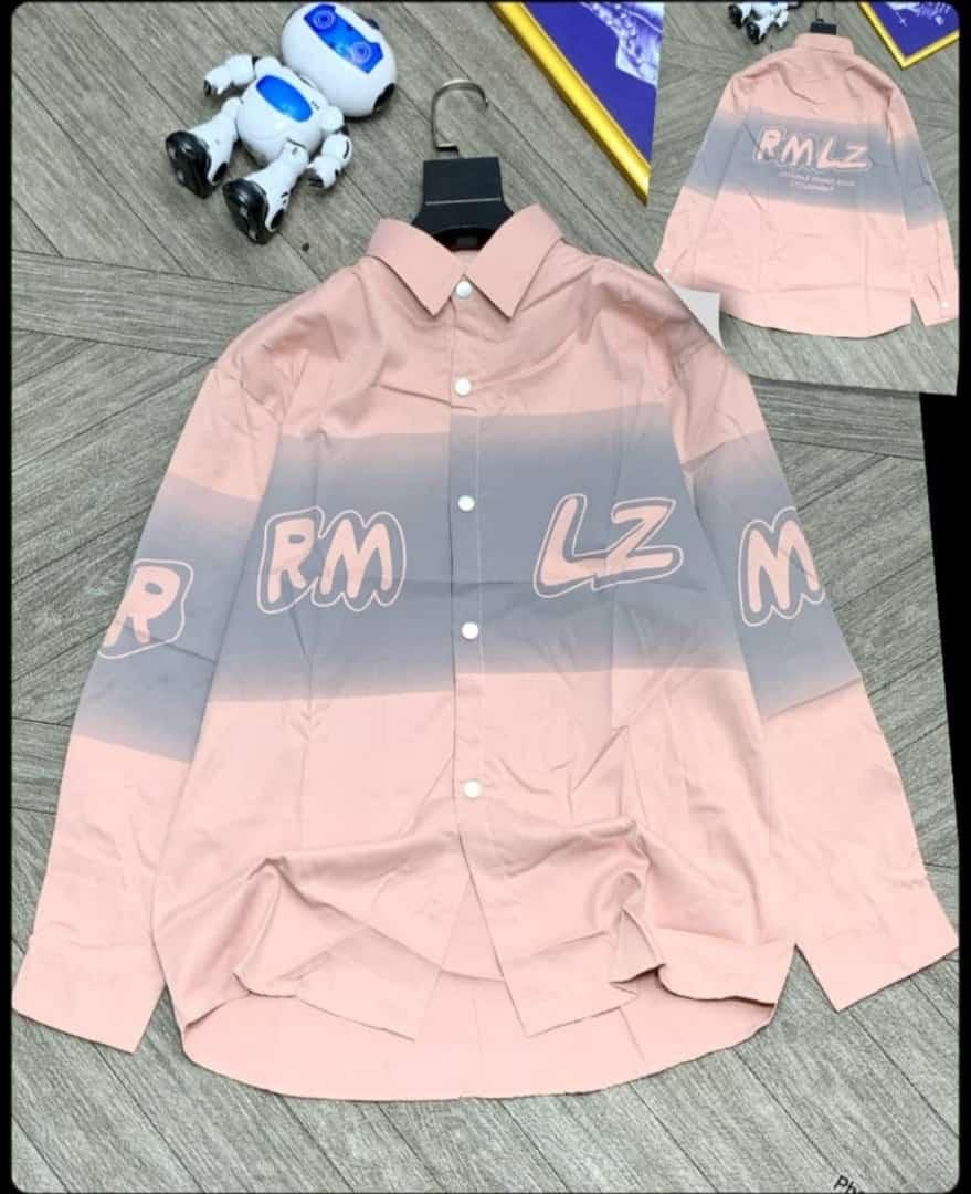 Pink gray gradient RMLZ print long sleeve shirt on wooden surface with robot toy.