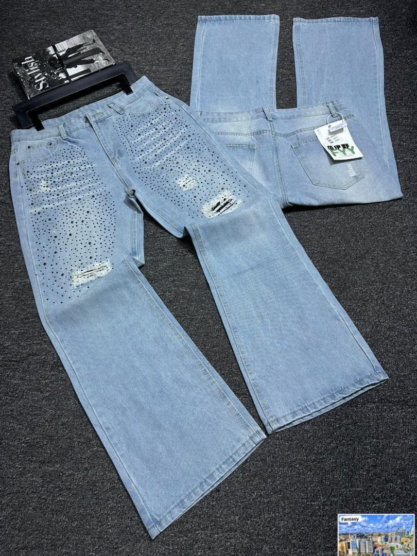 Light blue distressed baggy jeans with perforated patterns and rips shown from multiple angles.