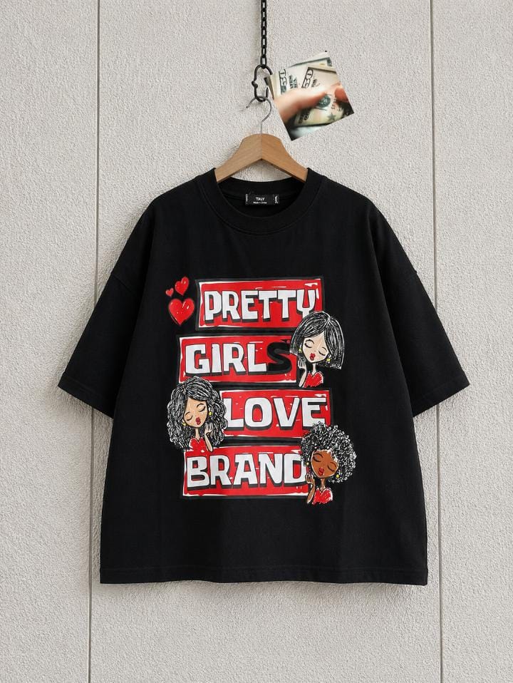 Black cropped tee with Pretty Girls Love Brand cartoon graphic and hearts.