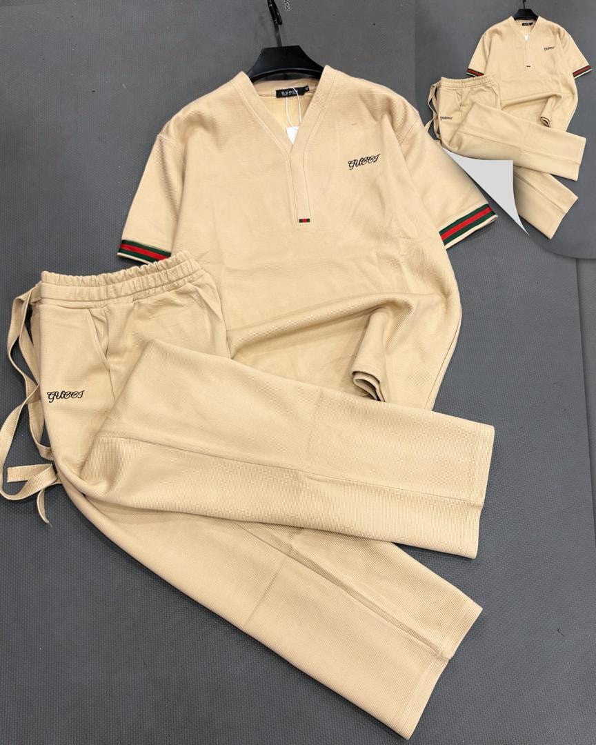 Beige ribbed knit two-piece set displayed in flat lay with detail inset.