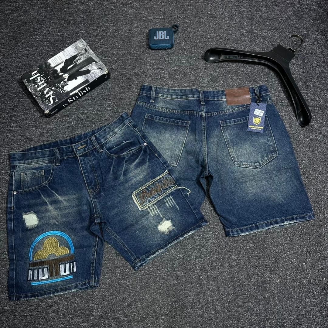 Blue denim shorts with MUTUH graphic patch, additional patches and lifestyle styling.