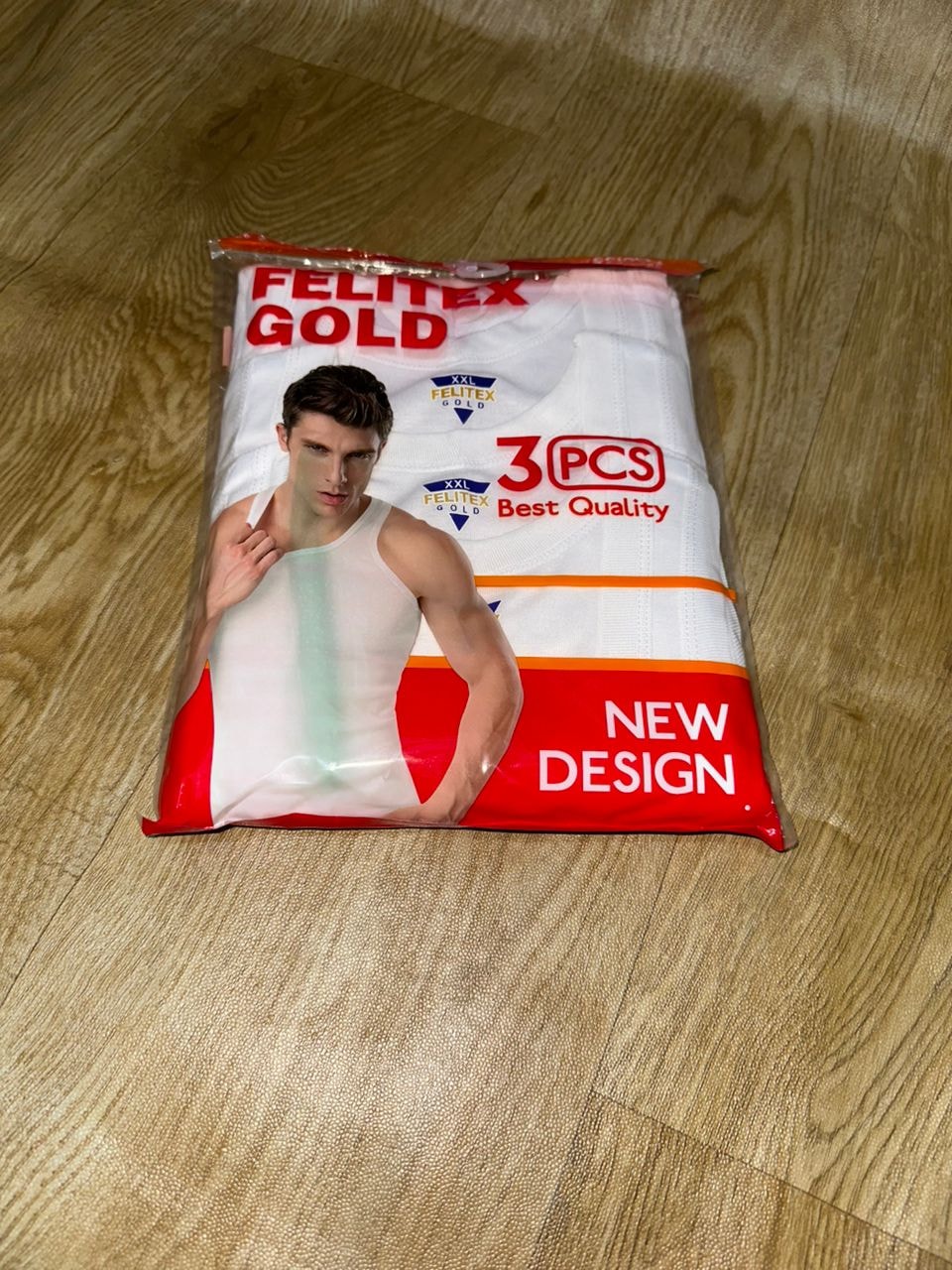 Close view of Felitex Gold new design 3pcs white singlet pack in clear plastic.