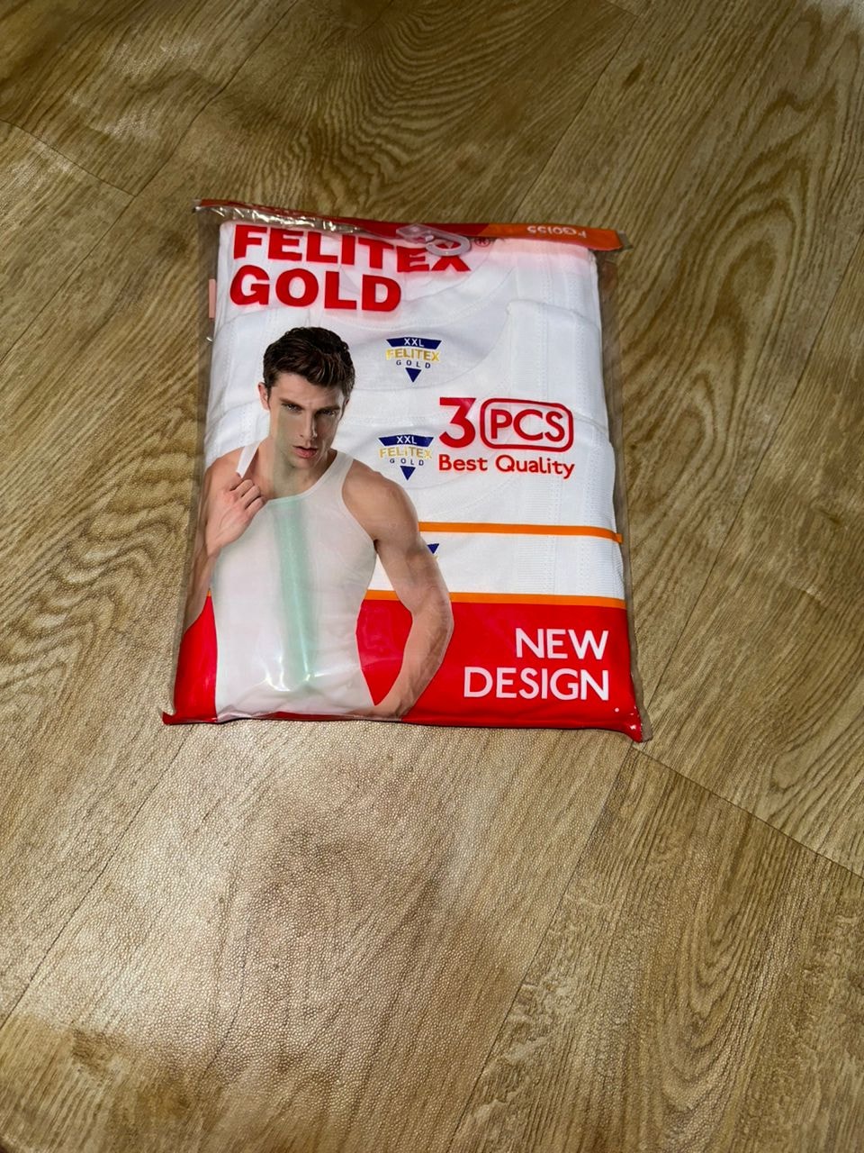 Felitex Gold 3pcs singlet packaging on wooden floor showing model and best quality labels.