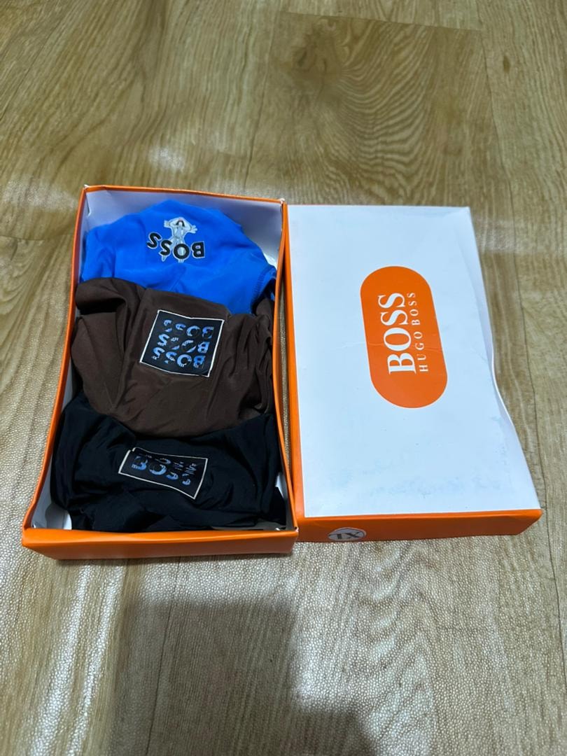 Hugo Boss box showing blue, brown, and black pairs of boxer briefs.