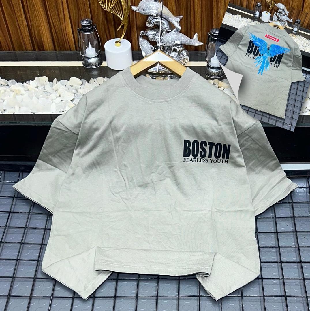 Beige Boston Fearless Youth oversized t-shirt showing text and graphic details.