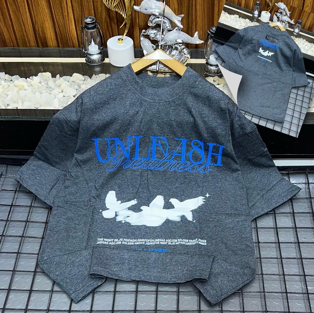 Gray Unleash Greatness oversized t-shirt featuring front design and back detail.