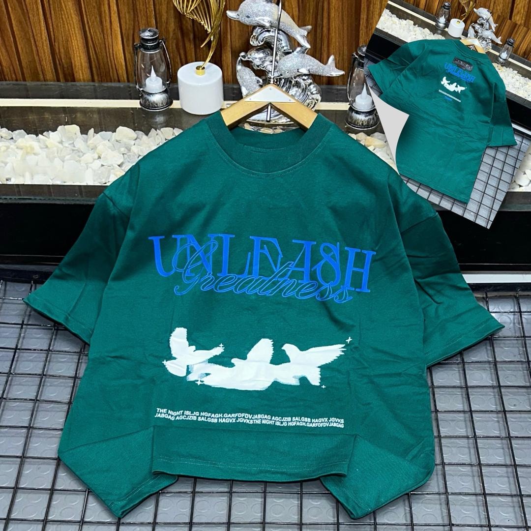 Green Unleash Greatness oversized t-shirt displaying chest print and back view.
