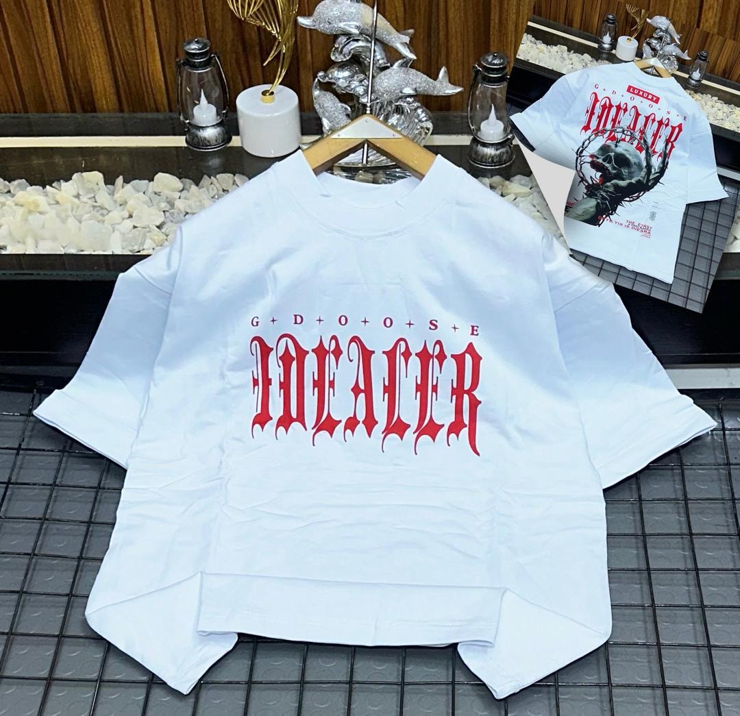 White oversized t-shirt with red IDEALER gothic text on front.