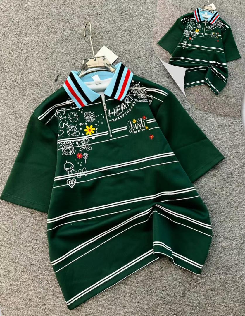 Green printed quarter-zip polo shirt with doodle graphics and striped collar.