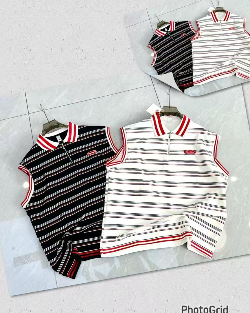 Black and white striped armless polos on display with matching striped collars.