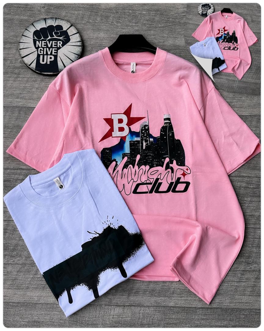 Pink oversized t-shirt with Midnight Club city and star graphic alongside folded light blue tee and inset variants.
