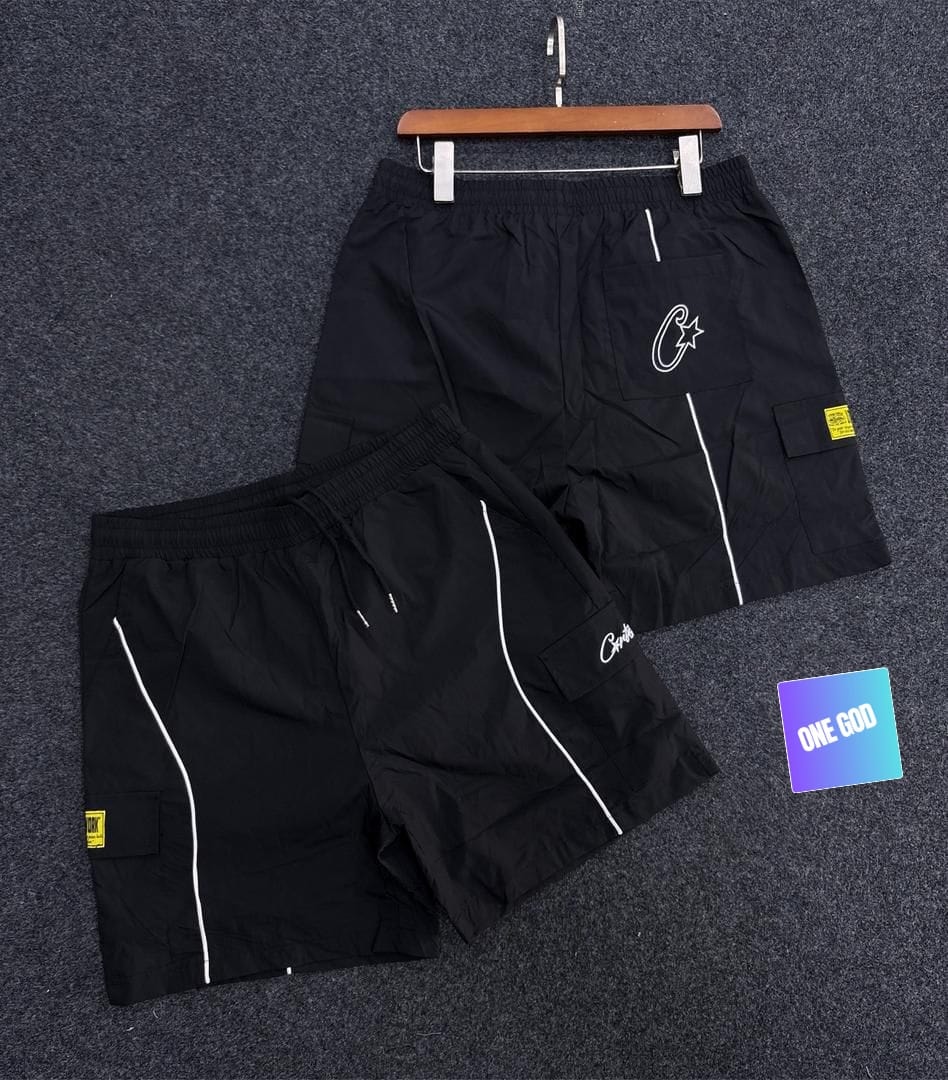 Black cargo pocket contrast shorts with white piping and embroidered logo.