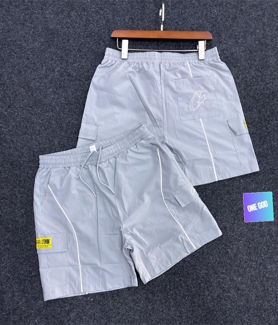 Light gray cargo pocket contrast shorts with white piping and star logo.