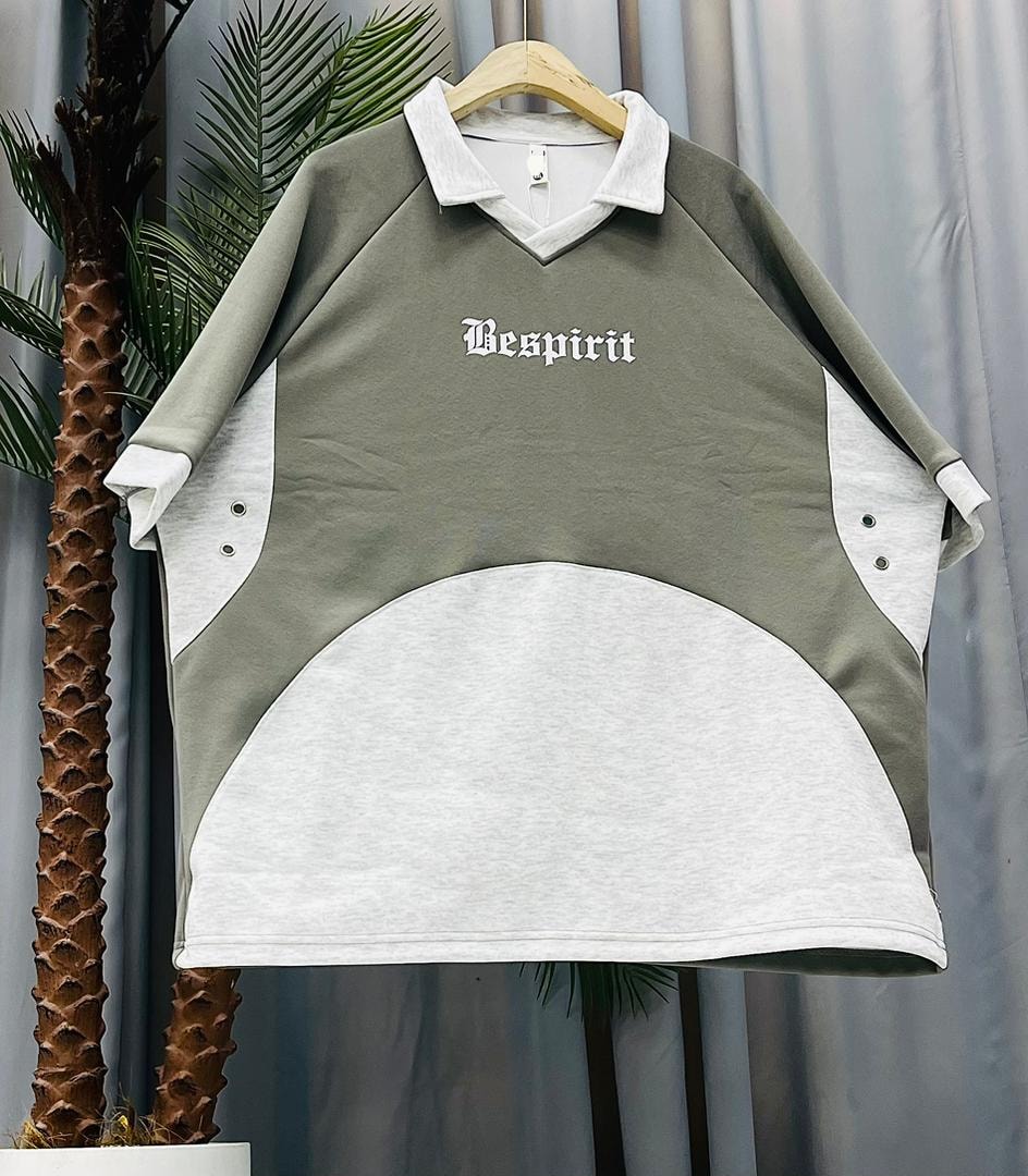 Olive unisex colorblock V-neck tee with white panels and Vesprit chest print.