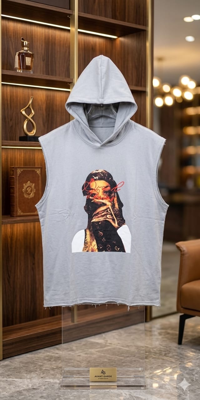 Light gray sleeveless hoodie with woman portrait graphic and red text, displayed on clear acrylic stand.