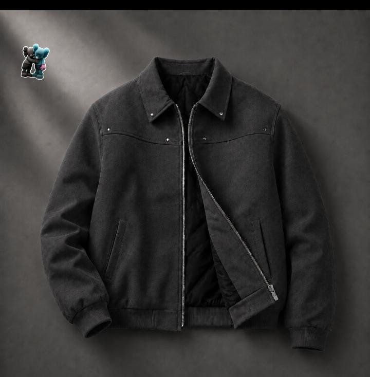 Black suede bomber jacket with zip closure and black quilted lining.