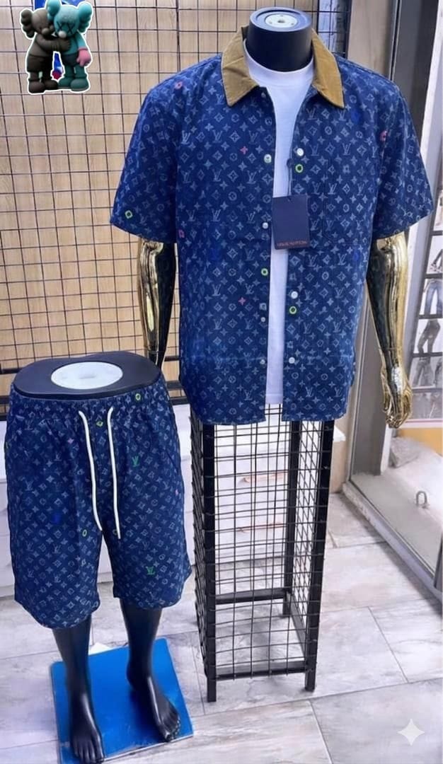 Blue monogram print short-sleeve shirt with brown collar and matching shorts.