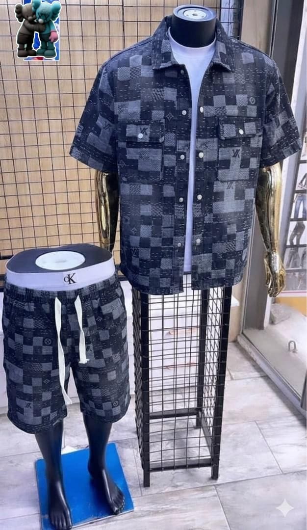 Gray and black patchwork monogram shirt and shorts set on display.