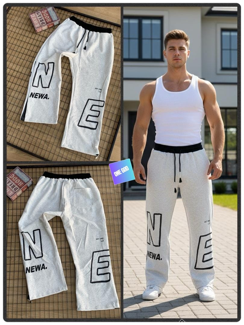 Light gray NEWA letter graphic joggers shown in flat lay and worn by model.