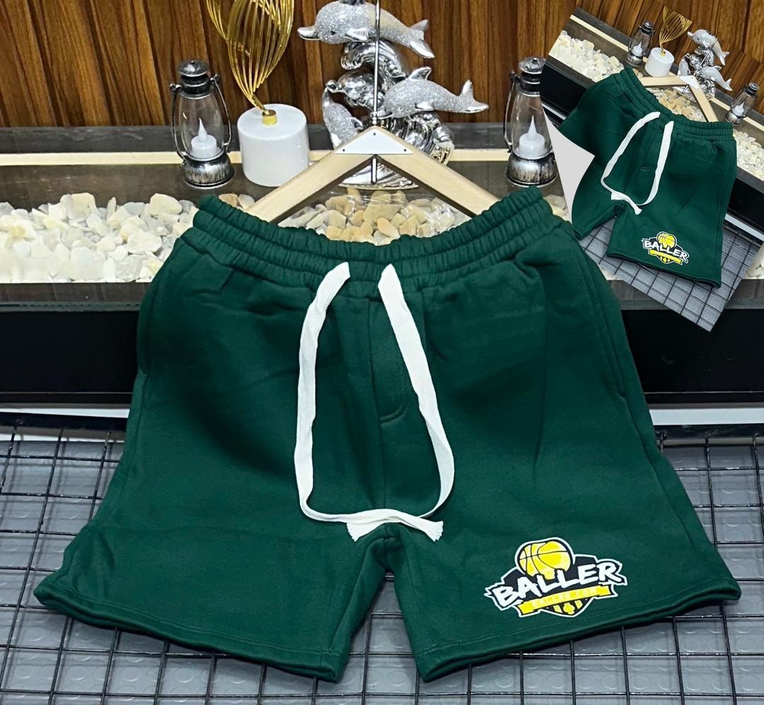 Dark green short joggers with Baller basketball logo embroidery.