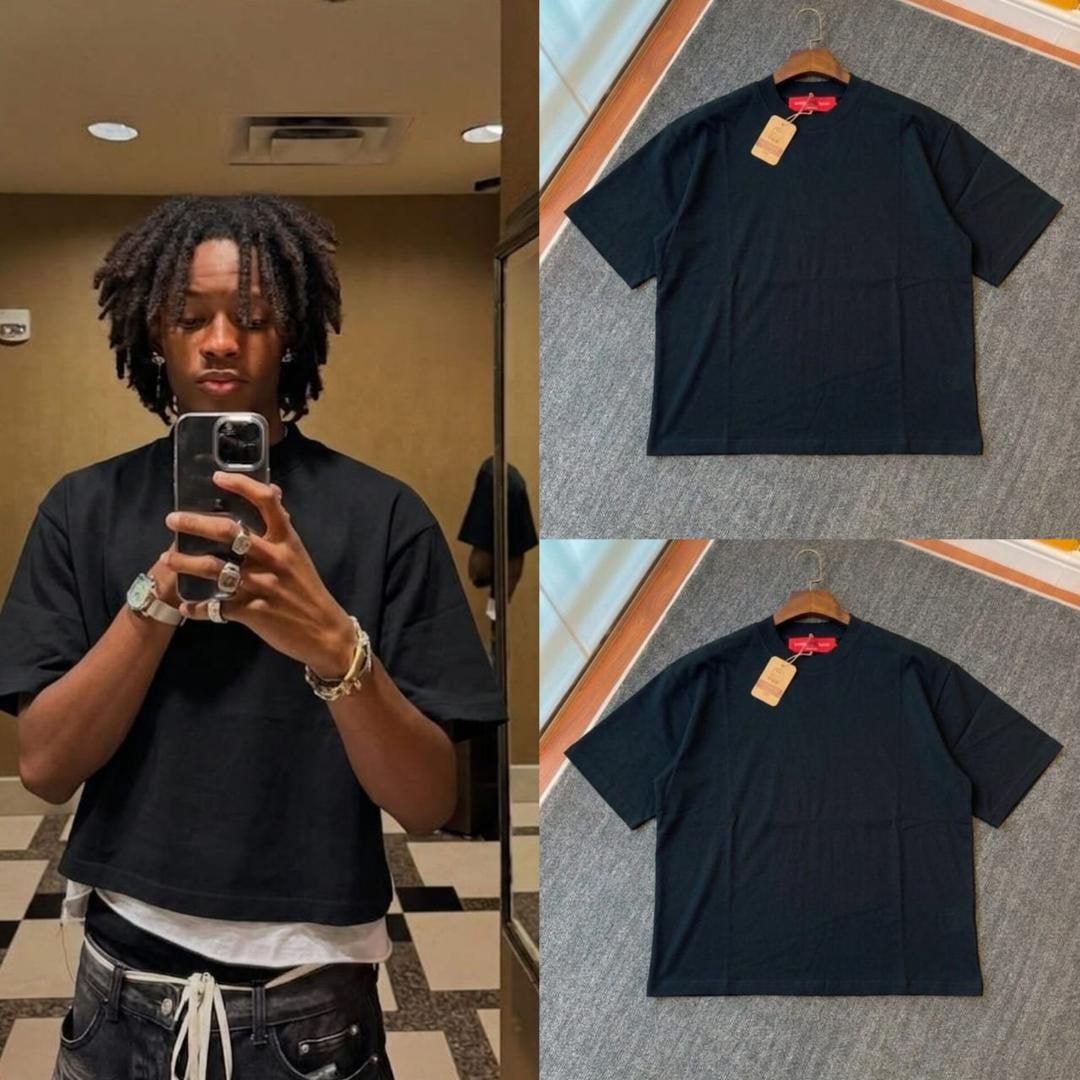 Man in mirror selfie wearing black plain crop tee with flat lay and hanging views of the black tee.
