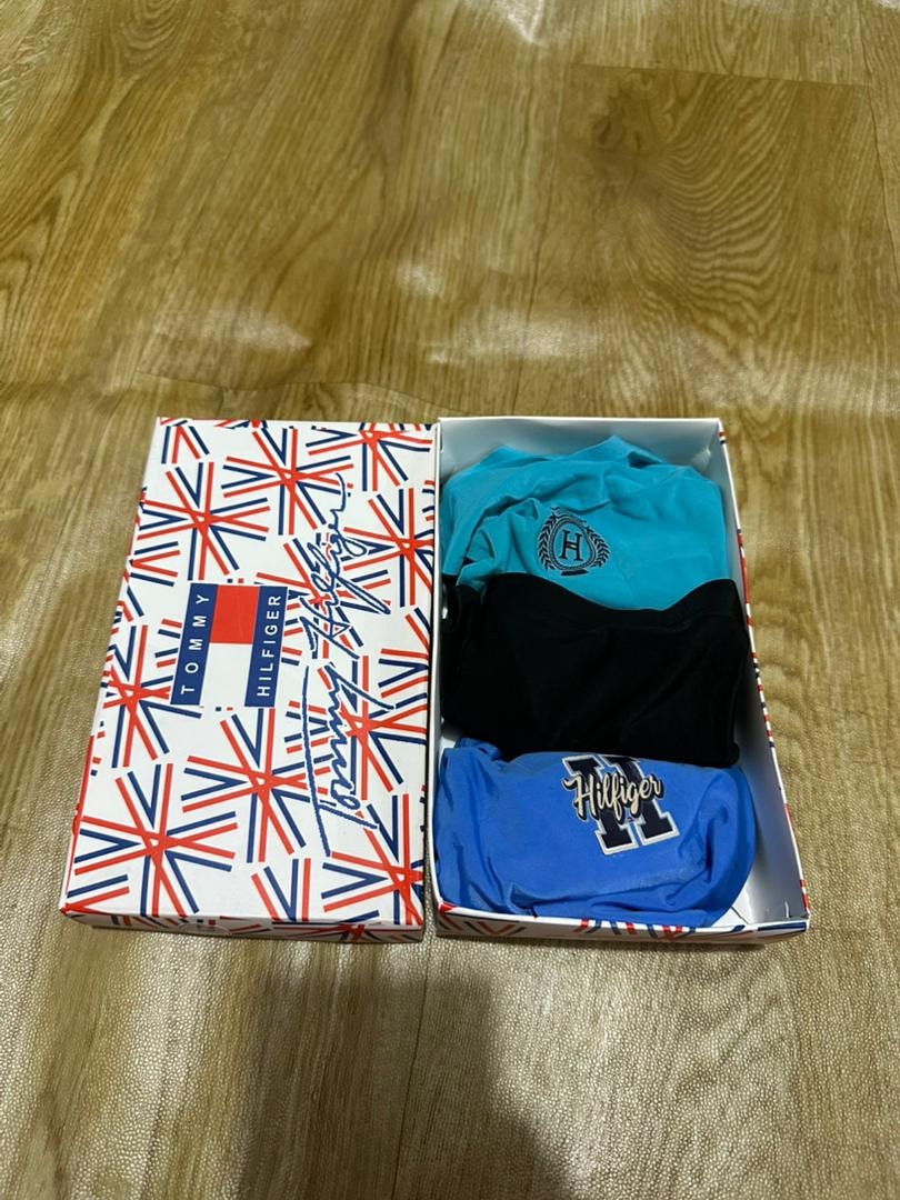 Tommy Hilfiger 3-pack briefs in turquoise, black and blue inside Union Jack patterned box.