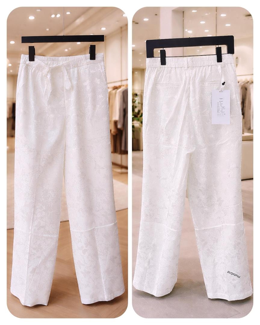 White patterned trousers displayed from front and back views.