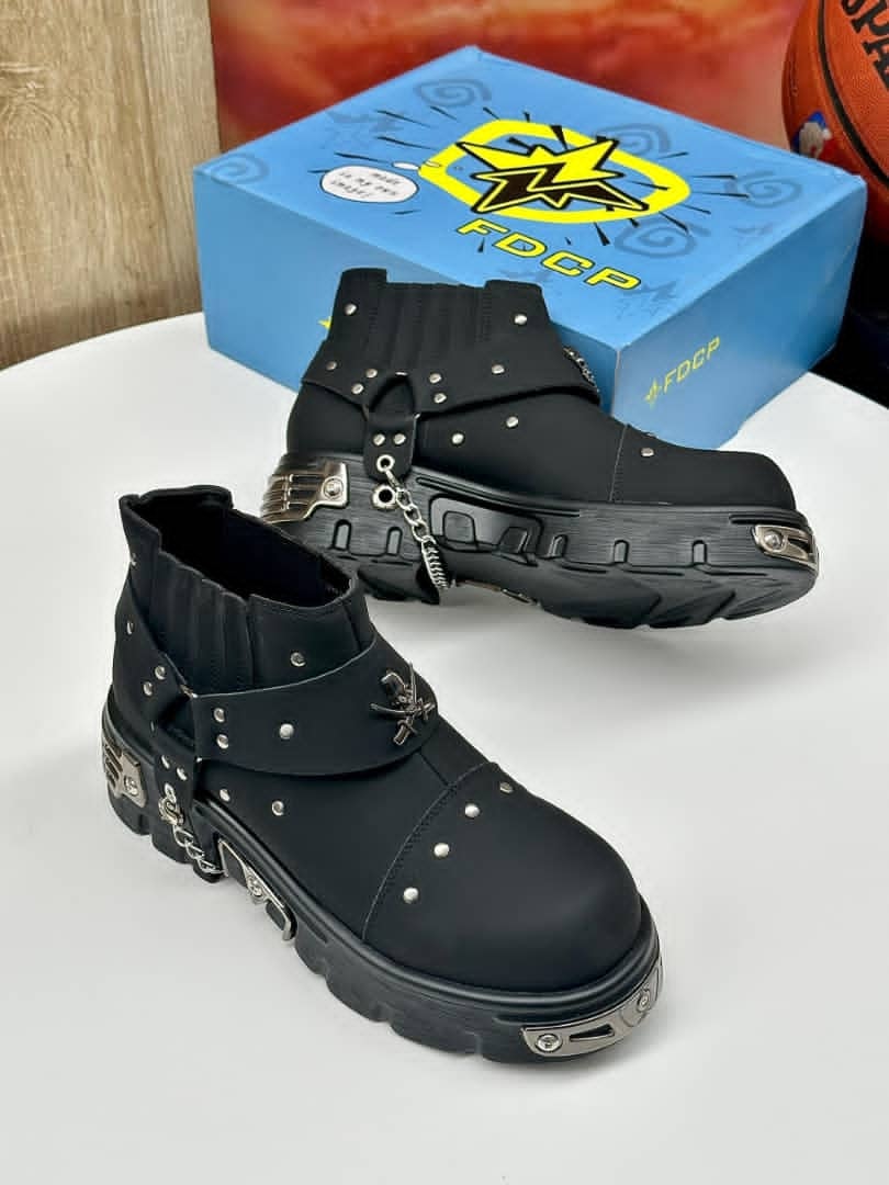 Black studded biker boots with chains displayed with blue FDCP box and basketball.