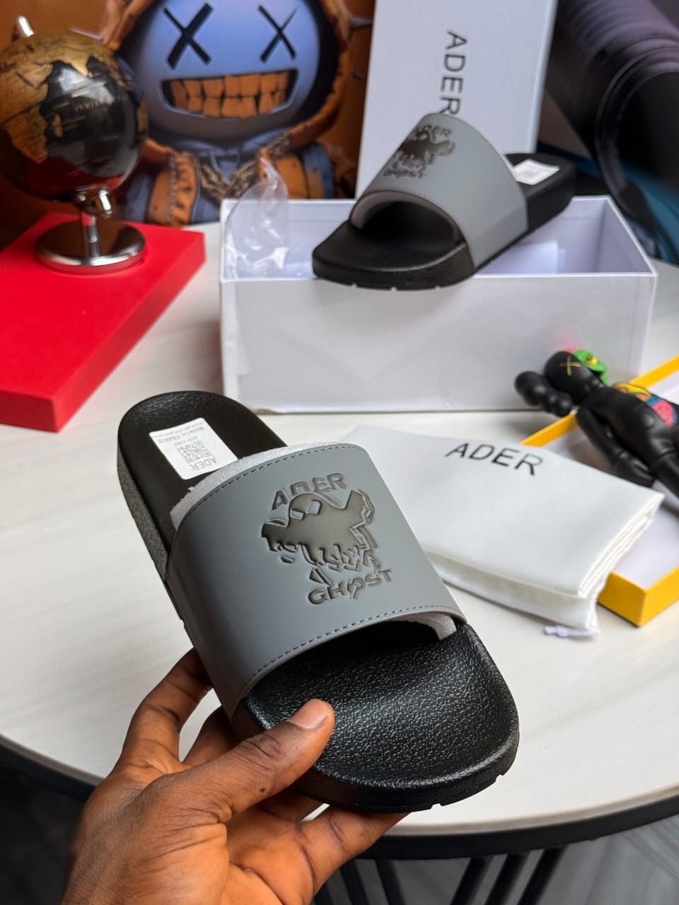 Close view of Ader Ghost slide from different angle with packaging visible.