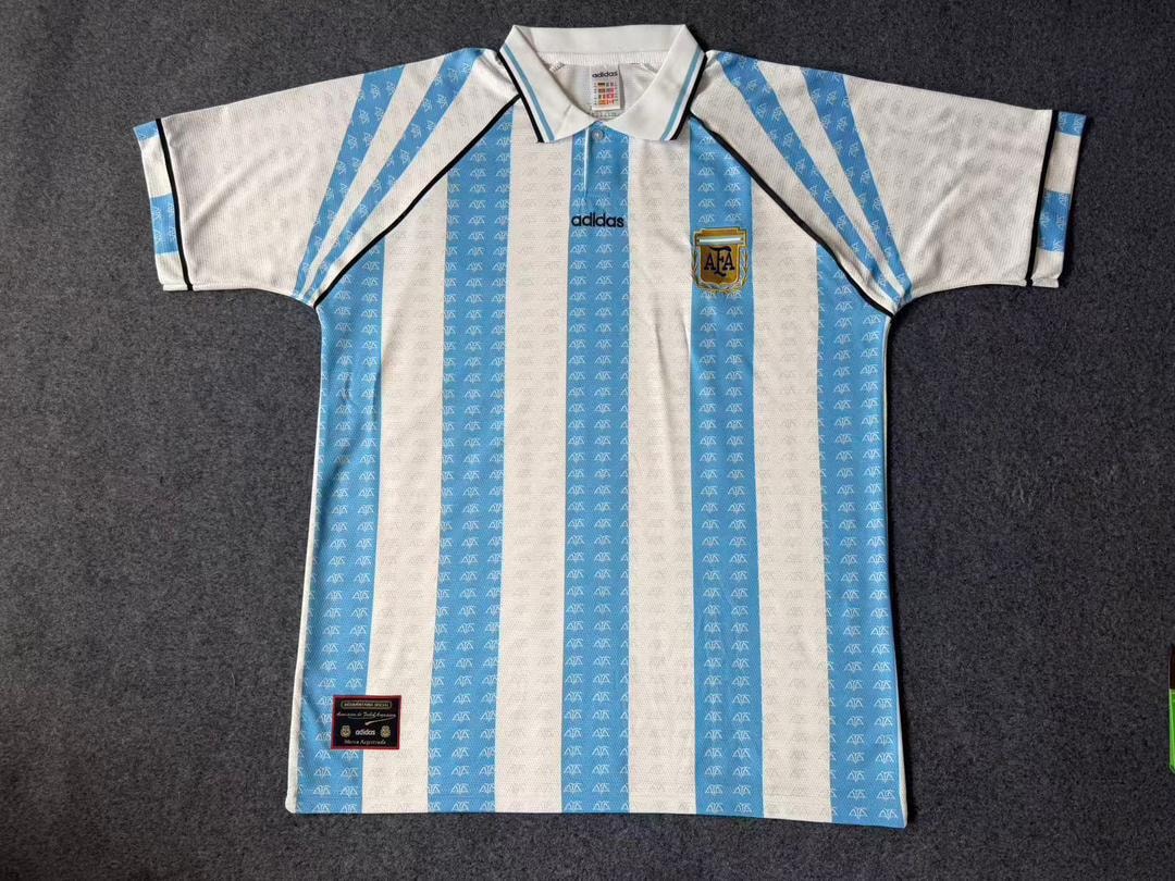 White and blue striped classic Argentina soccer jersey laid flat showing all details.