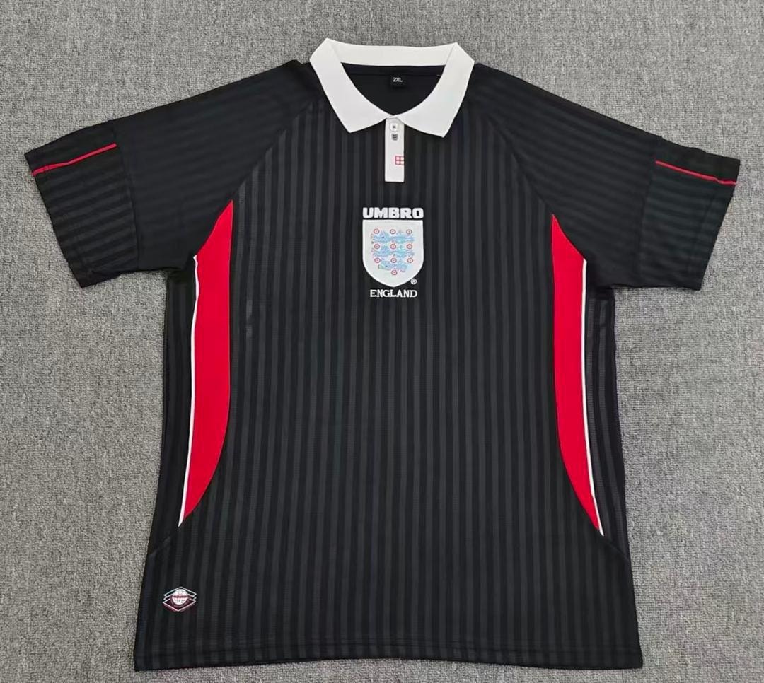Black striped England soccer jersey with red accents and Umbro logo laid flat.