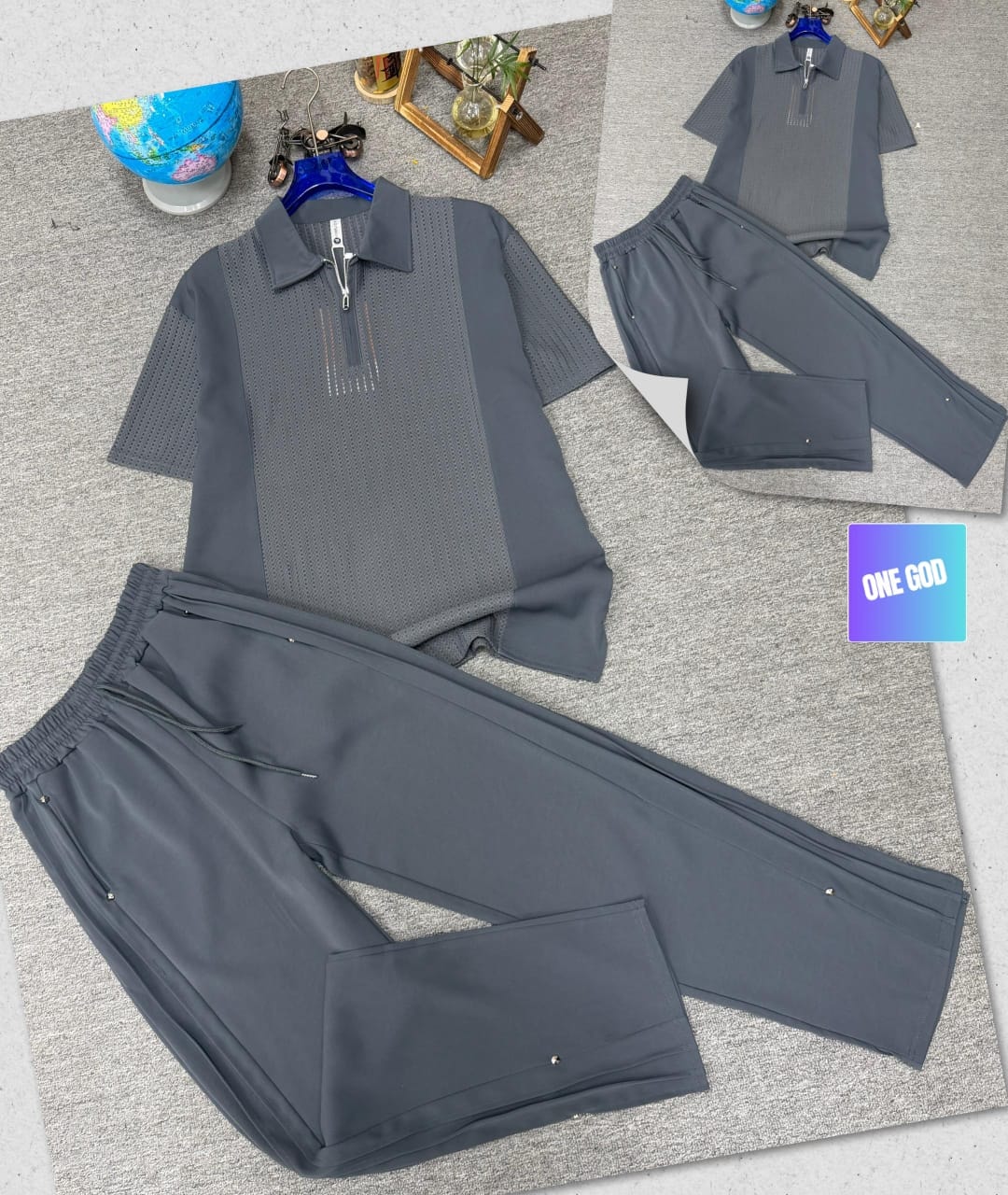 Gray perforated quarter-zip polo shirt and matching jogger trousers two-piece set.