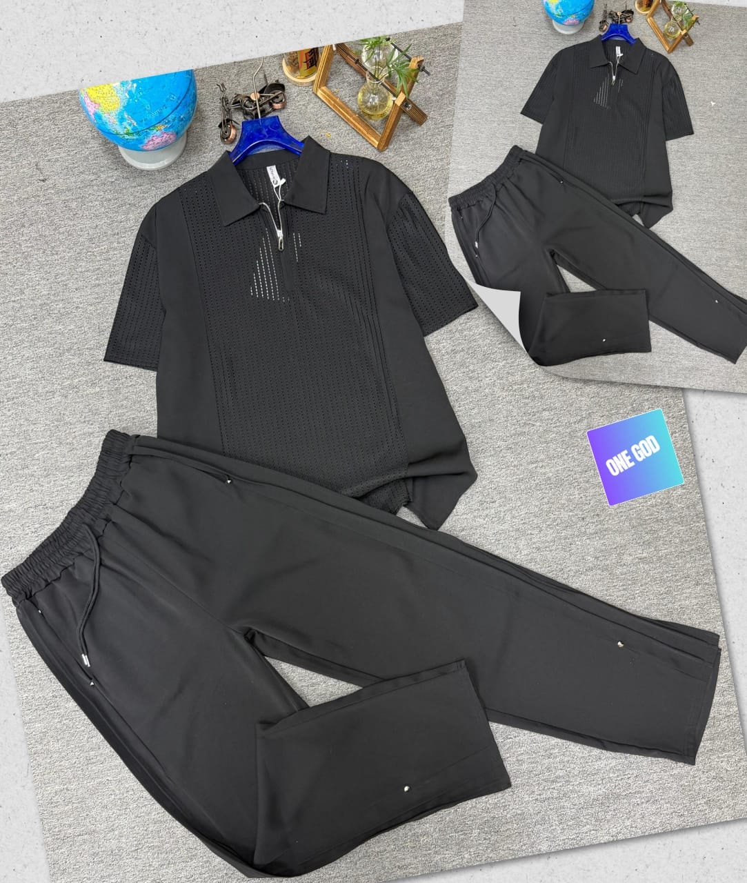 Black perforated quarter-zip polo shirt and matching jogger trousers two-piece set.