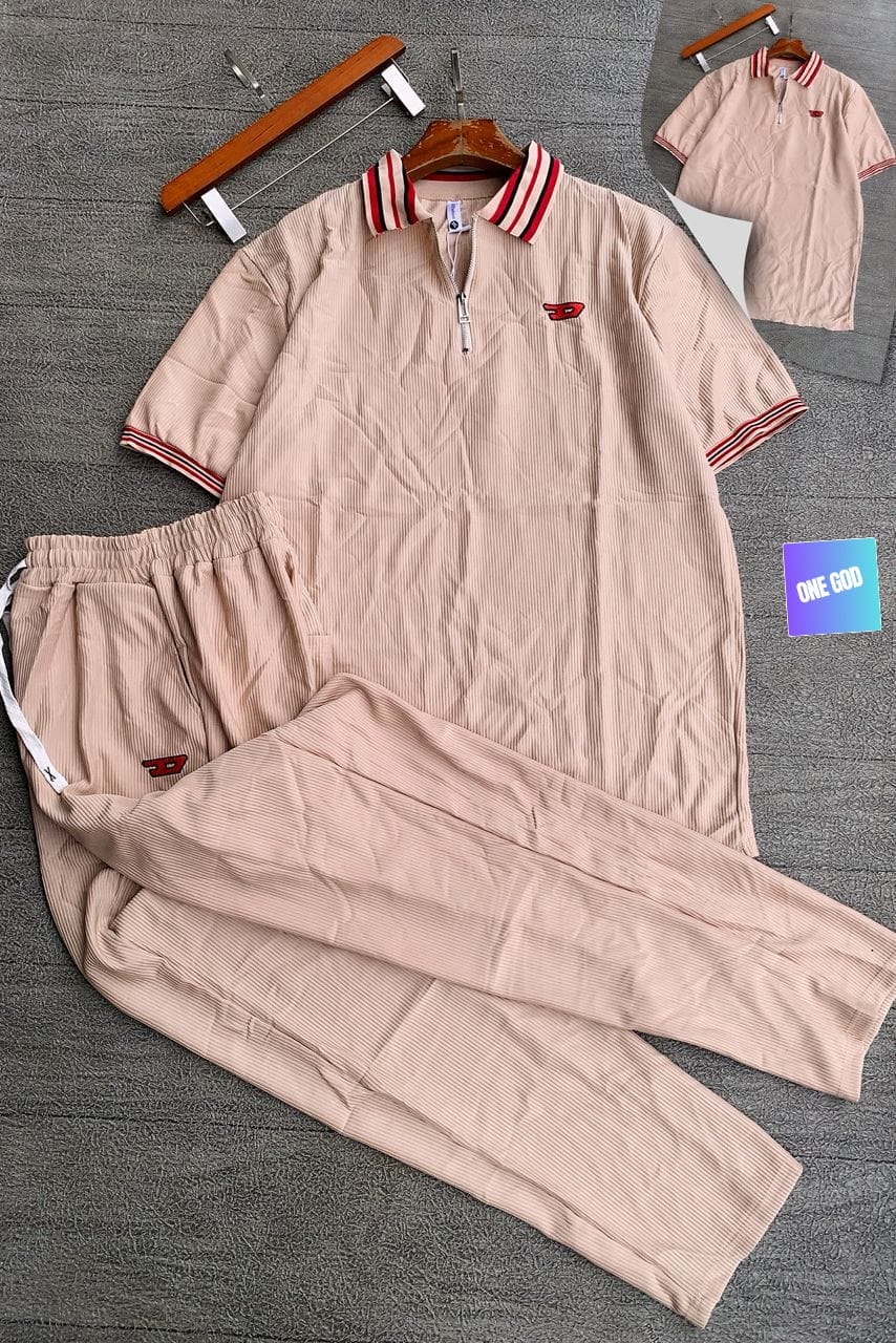 Beige ribbed two-piece set with striped collar and red logo.