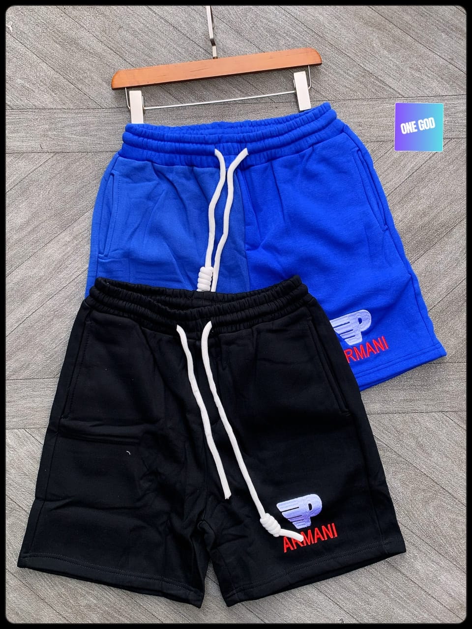 Black and blue fleece shorts with Armani embroidery and white drawstrings.