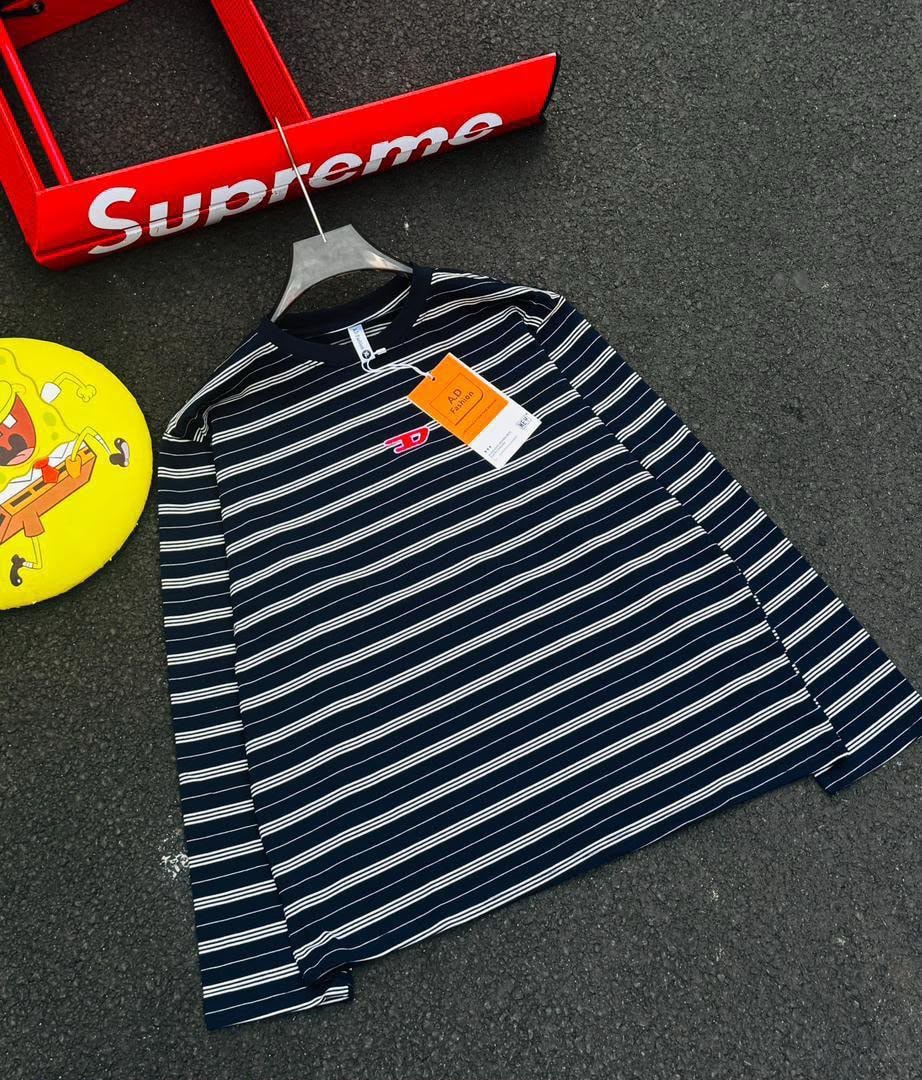 Navy with white stripes long sleeve t-shirt laid flat with visible tag.